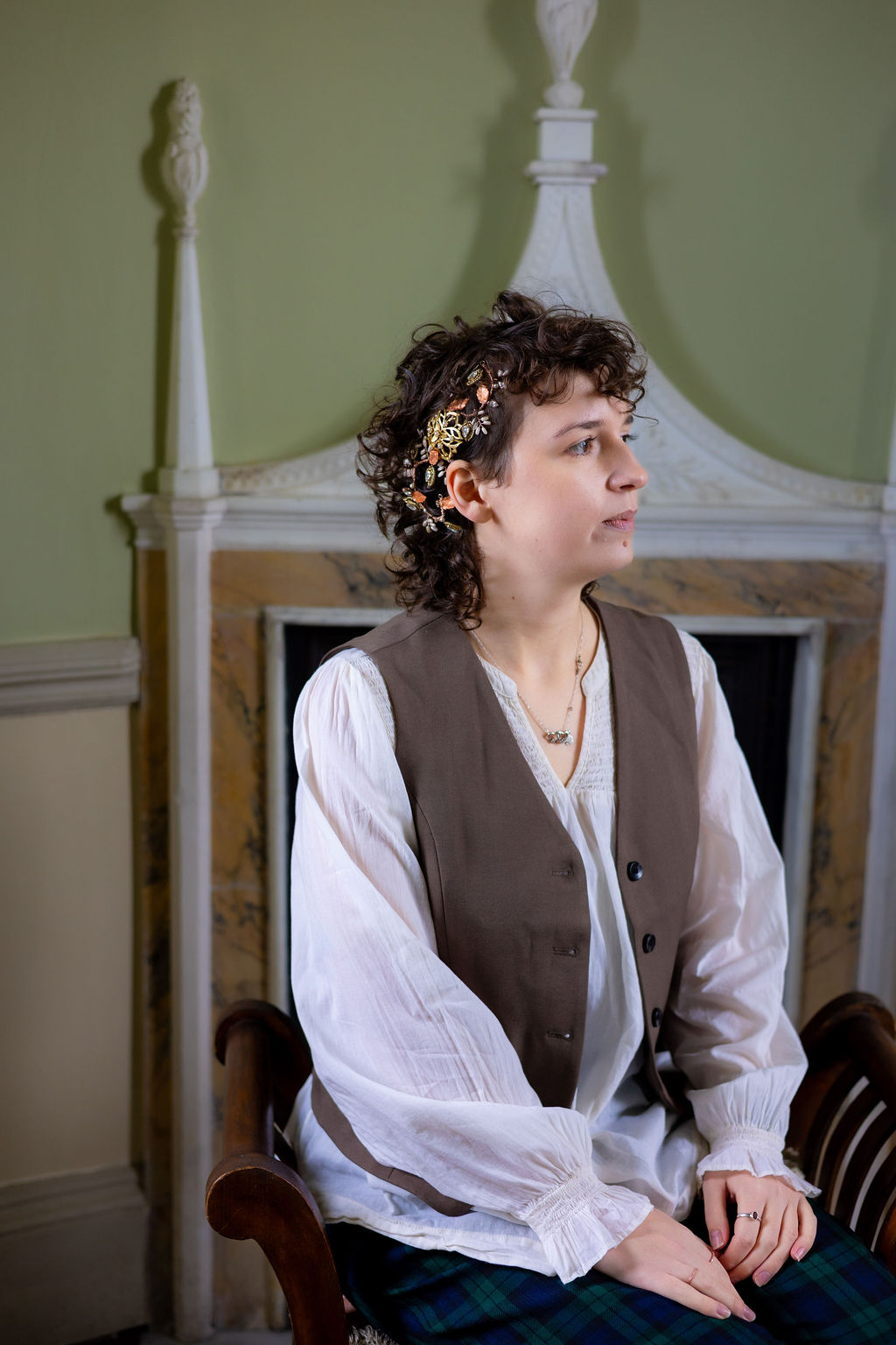 portrait of bride wearing flowing shirt and waistcoat as part of a historical inspired wedding