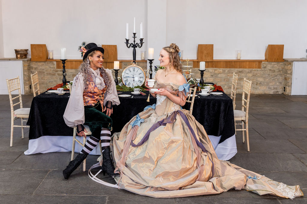 Two women in outfits inspired by Aline in Wonderland characters