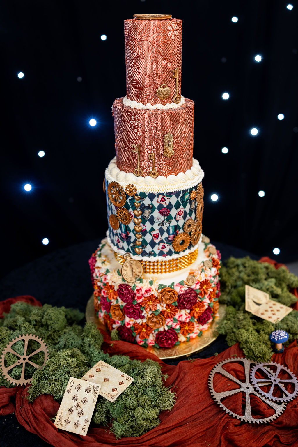 Alice in Wonderland inspired wedding cake with keys and cogs