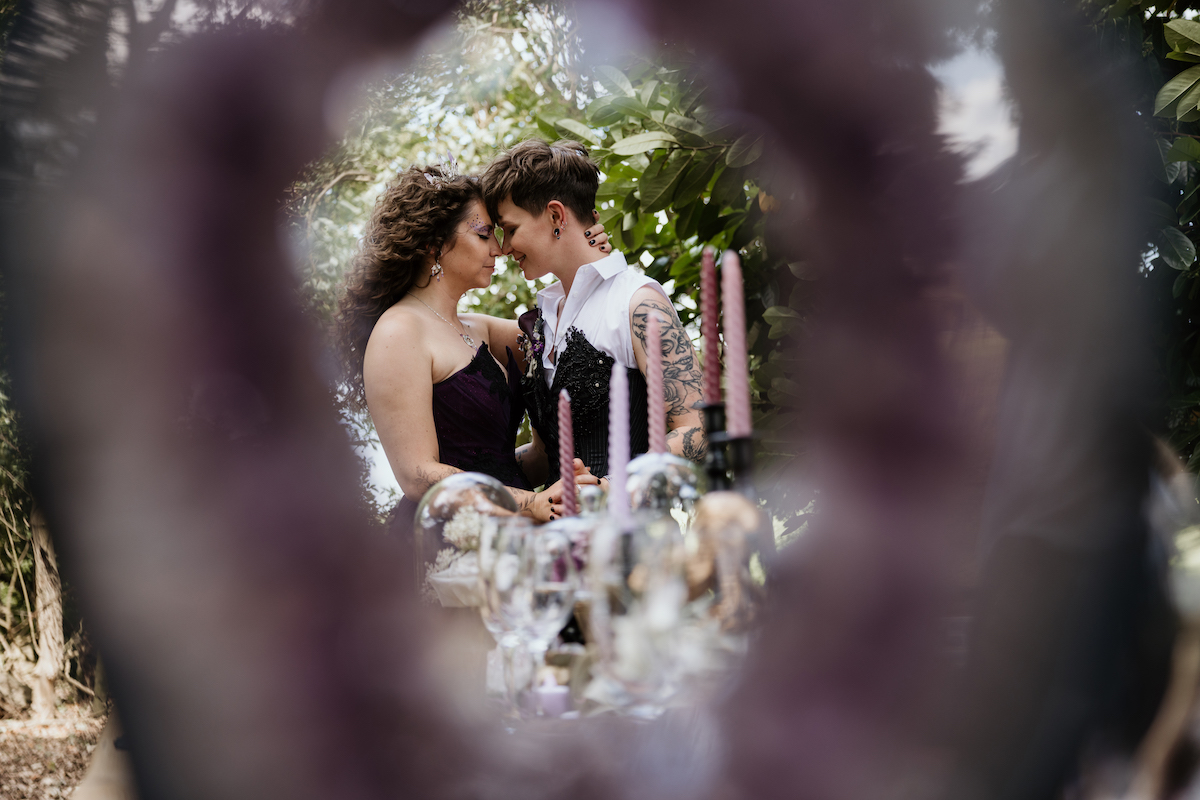 couple portrait captured through a quartz crystal
