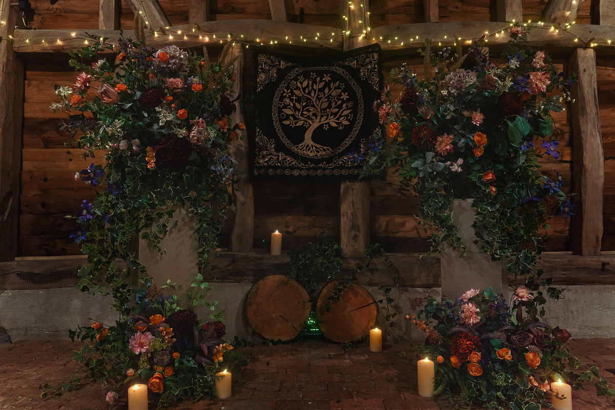 detail shot of the floral installation ceremony space with tree of life for pagan wedding.