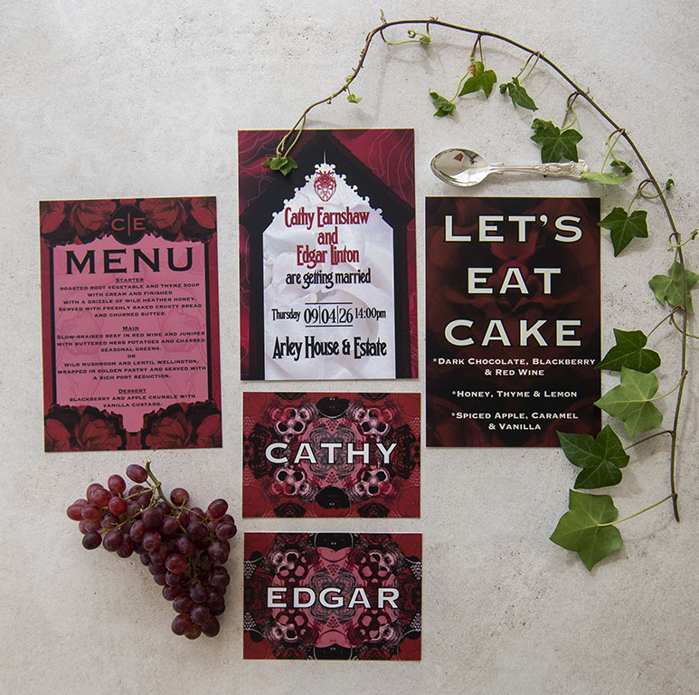 flat lay of deep red and pink alternative wedding stationery suit