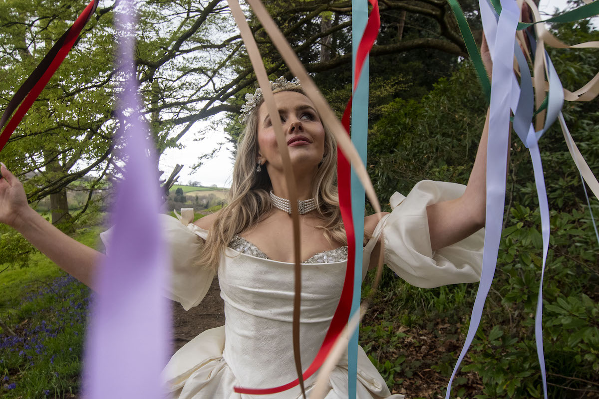 portrait of a bride shot through cascading ribbons for Wuthering Heights inspired wedding shoot