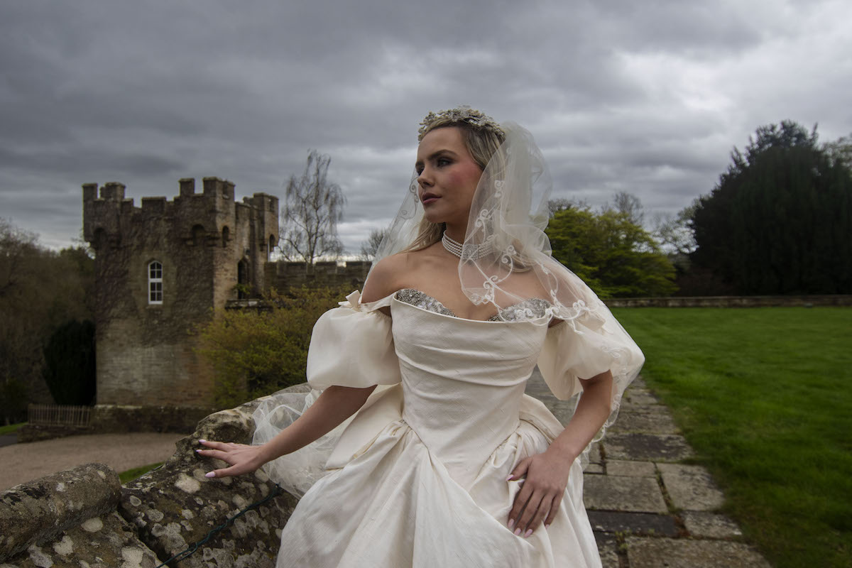 Wuthering Heights inspired bridal portrait with tower in the background
