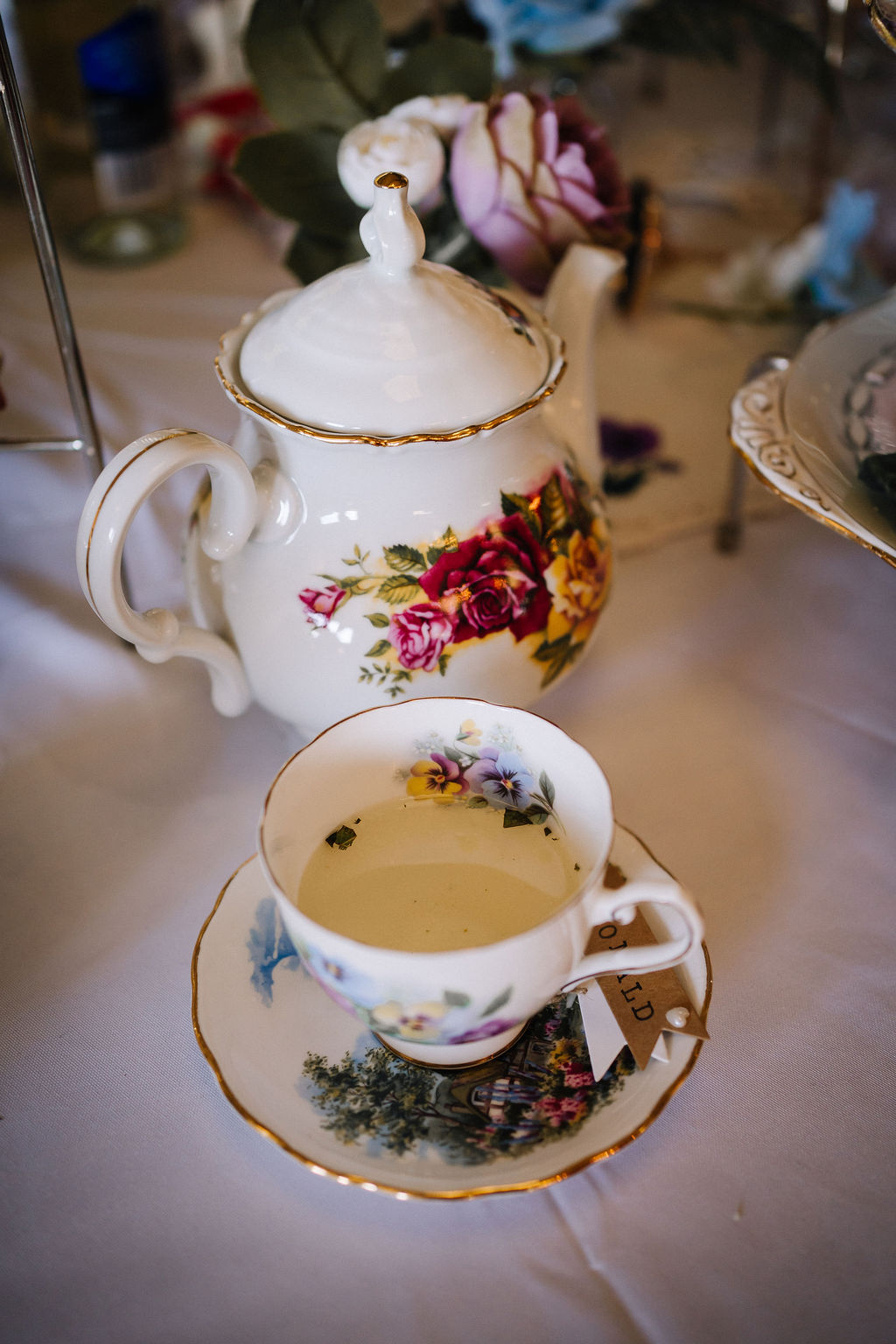 cocktail served in mismatched vintage tea sets for DIY thrifted wedding