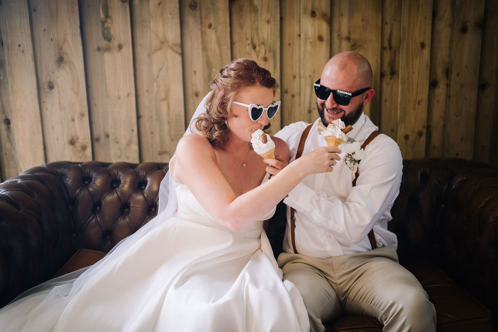 bride and groom feeding each other ice cream