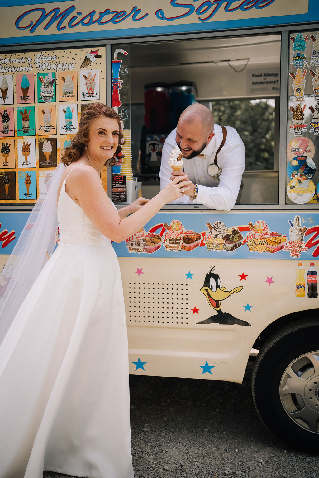 groom handing the bride an ice cream from a retro ice cream van