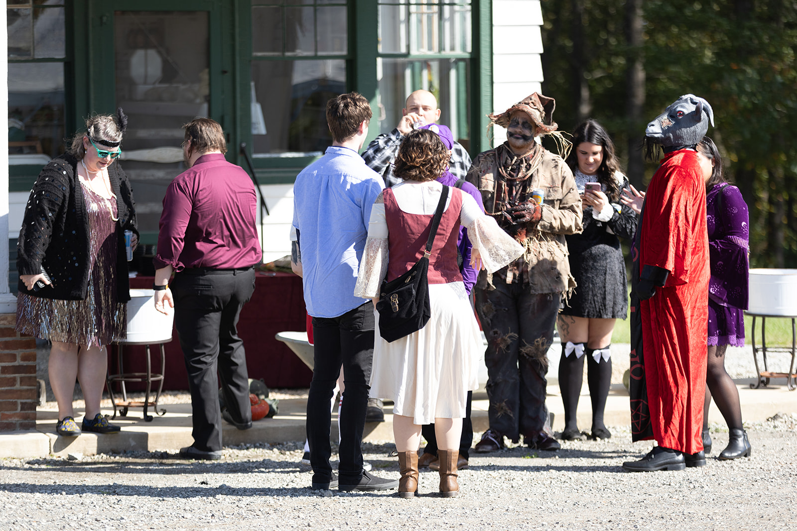wedding guests wearing halloween costumes ready for halloween wedding ceremony