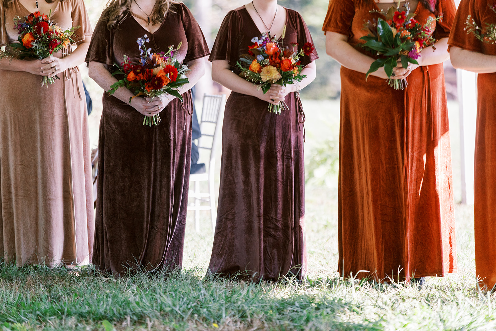bridesmaid dresses in shades of orange and browns for Halloween wedding