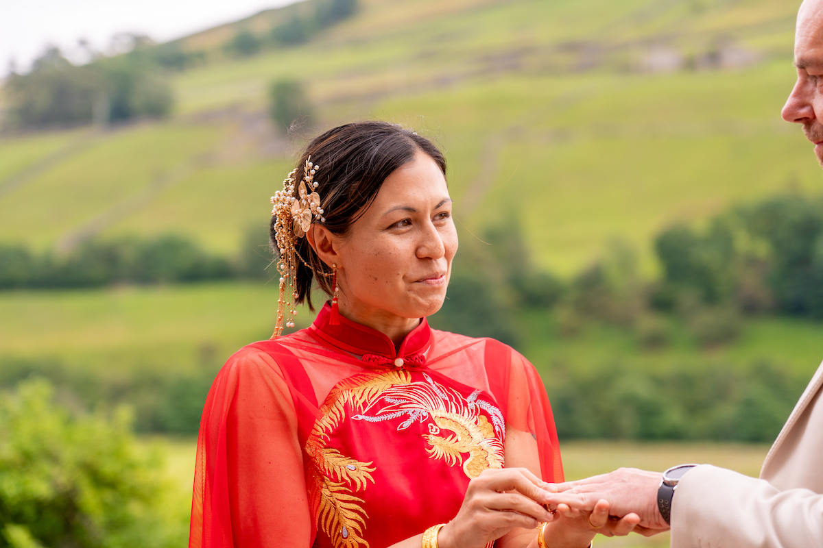 bride wearing ornate hair accessories and red Chinese style wedding dress